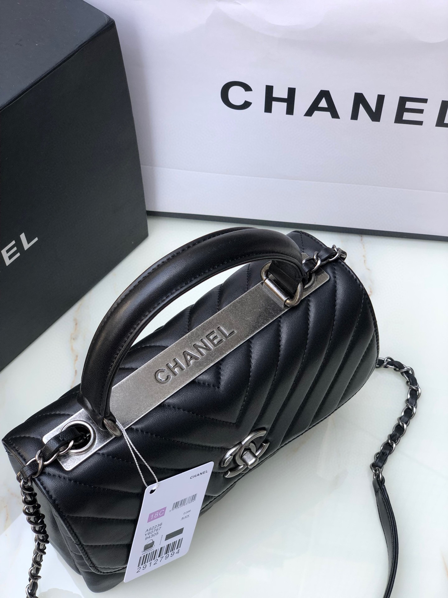 Ch*el flap bag with top handle 6.6 × 9.8 × 4.7 in